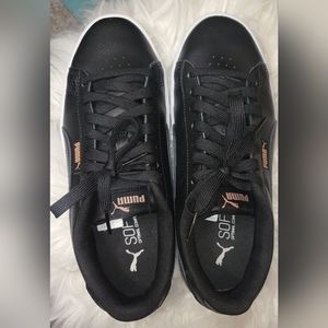 Gently used black and pink Puma sneakers size women's